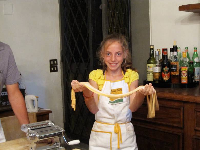 A-joyous-young-student-with-her-pasta-dough-in-our-Italian-culinary-school