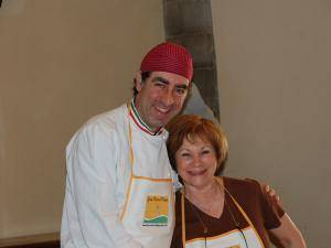 An-excited-student-posing-with-her-Italian-chef
